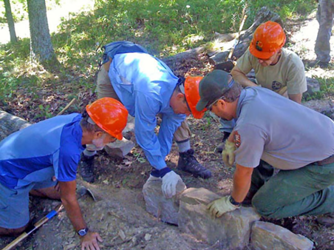 It was an all-hands (and fingers) evolution to set the new check dam